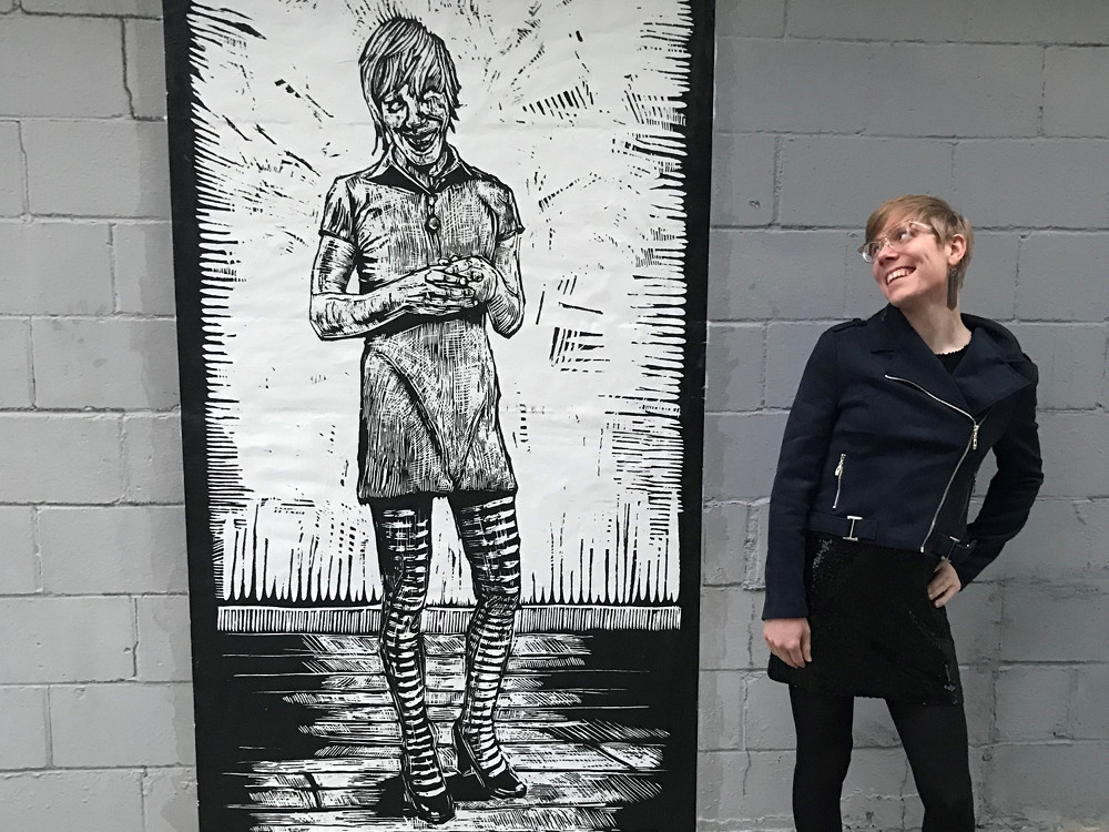 Me next to a mural of me in Omaha